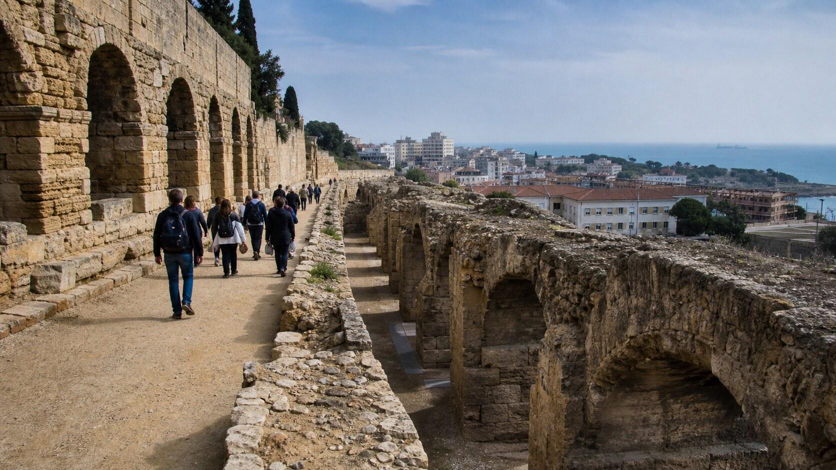 Visitors walking through Roman remains in Tarragona