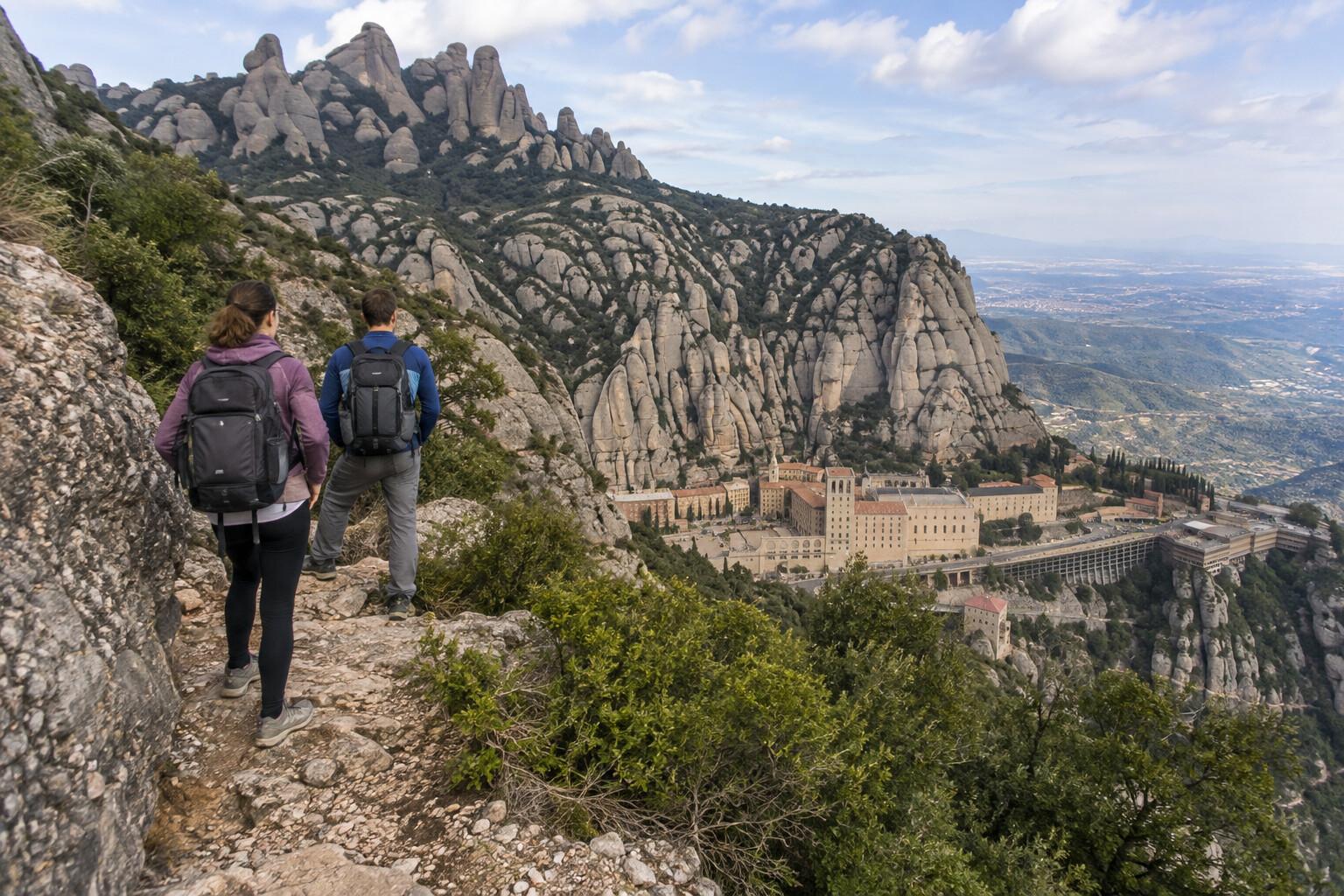 Hikers above the sanctuary buildings at Montserrat