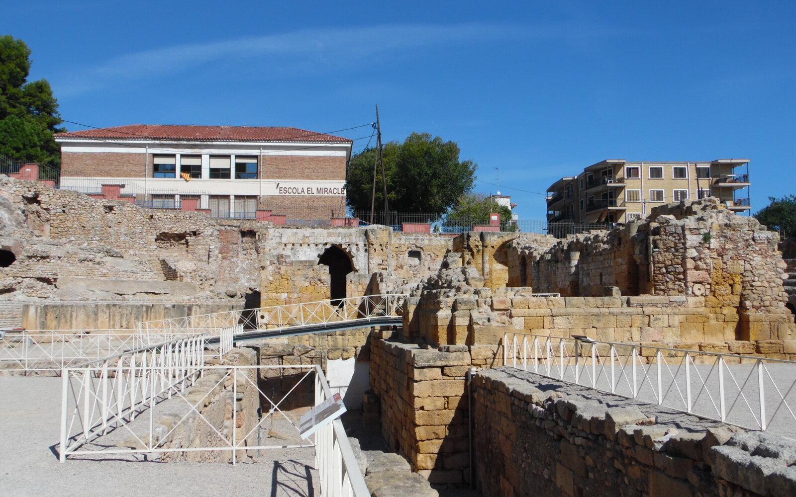 Stone seating and excavated passages inside Tarragona's Roman amphitheatre