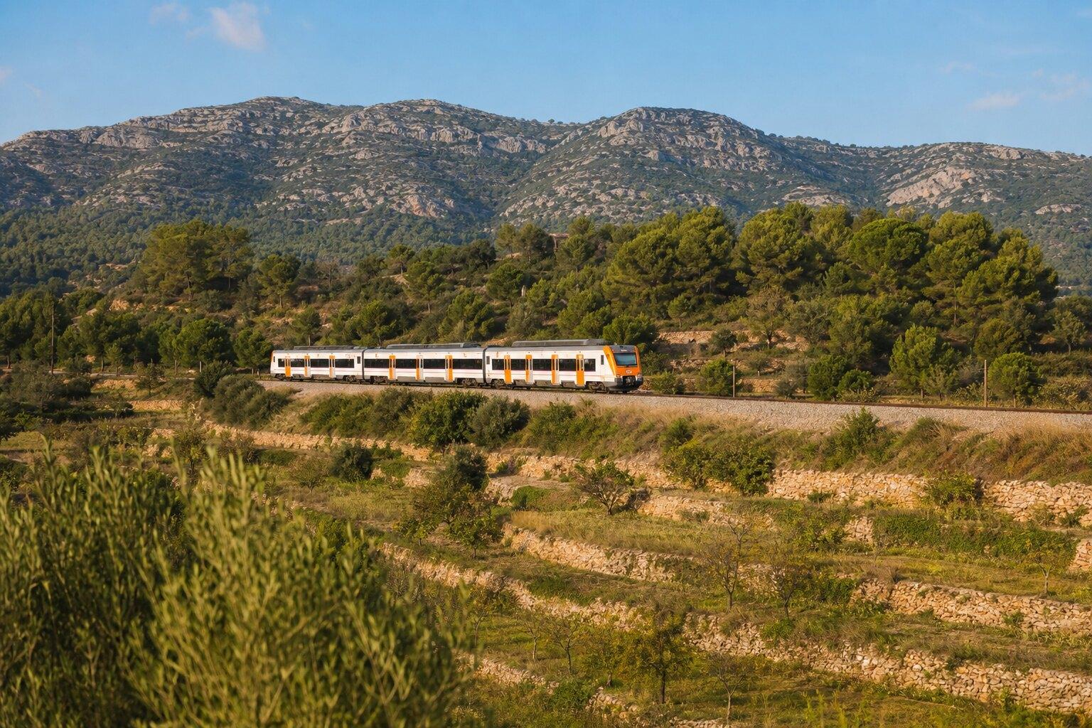Regional train passing through the Catalan countryside